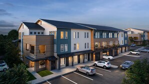 A multi-story residential building with a parking lot. - Landing | Chic 1BD, Clubhouse (Austin)
