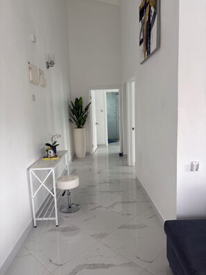 Interior - Modern 2BD Aqua Apt with a stunning rooftop patio for sunbathing/relaxing, BBQ. (Choc)