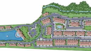 A residential area with multiple buildings, roads, and a central water feature. - Landing | Chic 2BD, Gym (Garland)