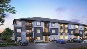 A multi-story residential building with balconies, a parking lot, and landscaped areas. - Landing | Chic 1BD, Gym, Clubhouse (Asheville)