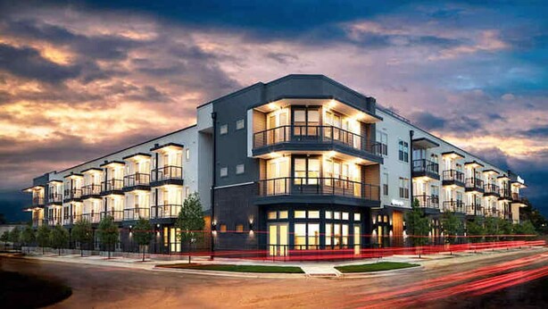 A multi-story hotel with balconies, large windows, and a modern architectural design. - Landing | Stunning Studio in Kessler Park (Dallas)