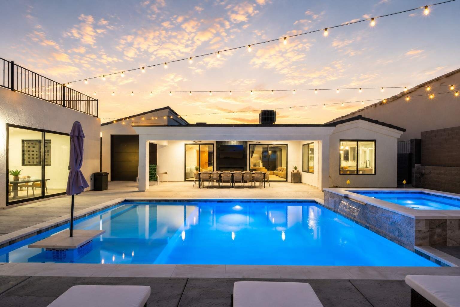 Desert Palm at sunset, with a luminous pool, open courtyard, and warm desert skies setting the tone for an unhurried Havasu stay.