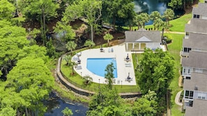 A residential area with a swimming pool, a gazebo, and a view of a lake. - 4BR NMB Ocean Drive Cottage, quiet community and walk to everything you need! (North Myrtle Beach)