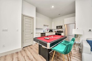 Games room - Houston luxury apartment: Pool, gym, game room, and a rooftop deck! (Houston)