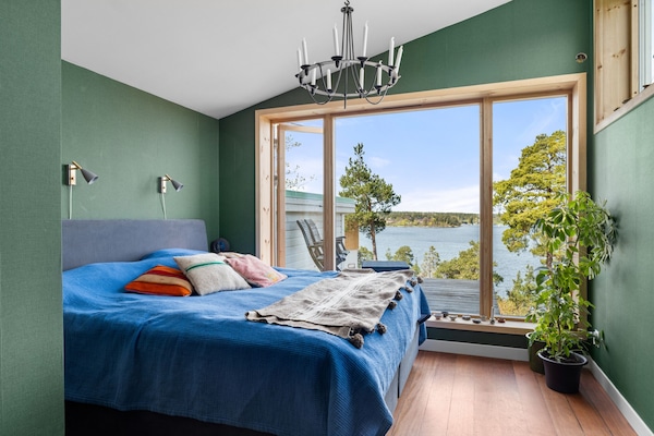 Master bedroom on the third floor with stunning views of the Stockholm archipelago