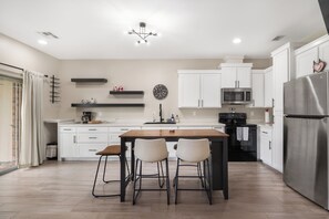 Fridge, microwave, oven, stovetop - The Lux Yard House | Modern 2BR w Private Backyard (Brownsville)