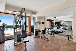 A gym with cardio machines, weight equipment, and a bench. - “Sugar Shack” 🐟 A PURE SALT PROPERTY 🐟 Brand New Rental (Orange Beach)