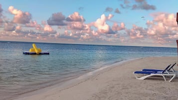 Beach nearby, white sand, beach towels