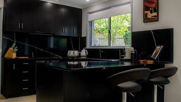 Coffee/tea maker, fridge, microwave, oven