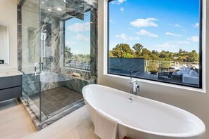 Shower, hair dryer, towels, shampoo