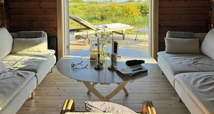 Log house in the first row at the Sejerø Bay