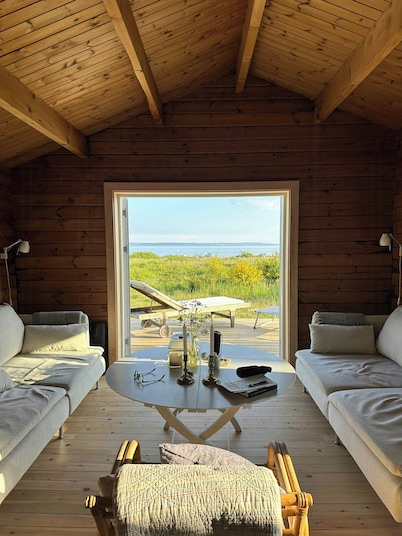 Log house in the first row at the Sejerø Bay