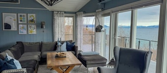 Cottage with northern lights near Stetinden