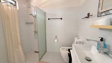 Shower, hair dryer, towels, soap