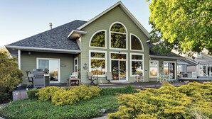 A house with a porch, a grill, and a garden. - 'Lake Garden House' w/ Hot Tub & Dock (Lake Odessa)