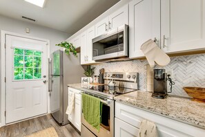 Fridge, microwave, stovetop, dishwasher - Updated Modern Cottage in Southwest Atlanta (Atlanta)