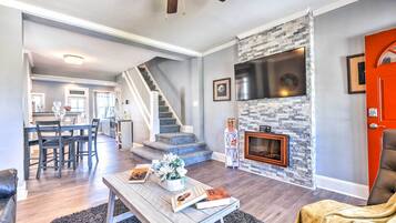 TV, fireplace, books