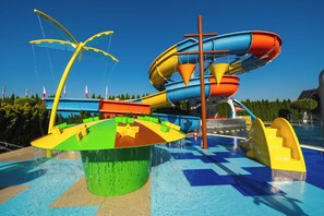 A water park with a large water slide, a wave pool, and various play structures. - Termy Szaflary (Szaflary)