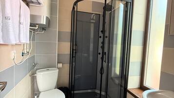 Premium Double Room, Garden View | Bathroom | Shower, hair dryer, towels, soap