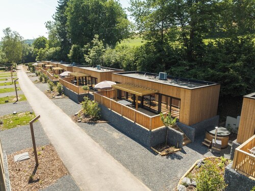 Luxury lodge with private hot tub where indoor and outdoor living blend seamlessly