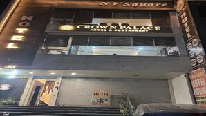 A hotel named 'Crown Palace Hotel & Restaurant' with a sign indicating it's located in N.Y.Square. - Crown Palace Hotel & Restaurant (Hapur)