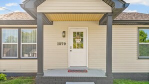A house with a white door, number 1579, and a welcome mat. - Extended Stay Near Fort Campbell | 2BR (1579 Mary Beth Ln) (Clarksville)
