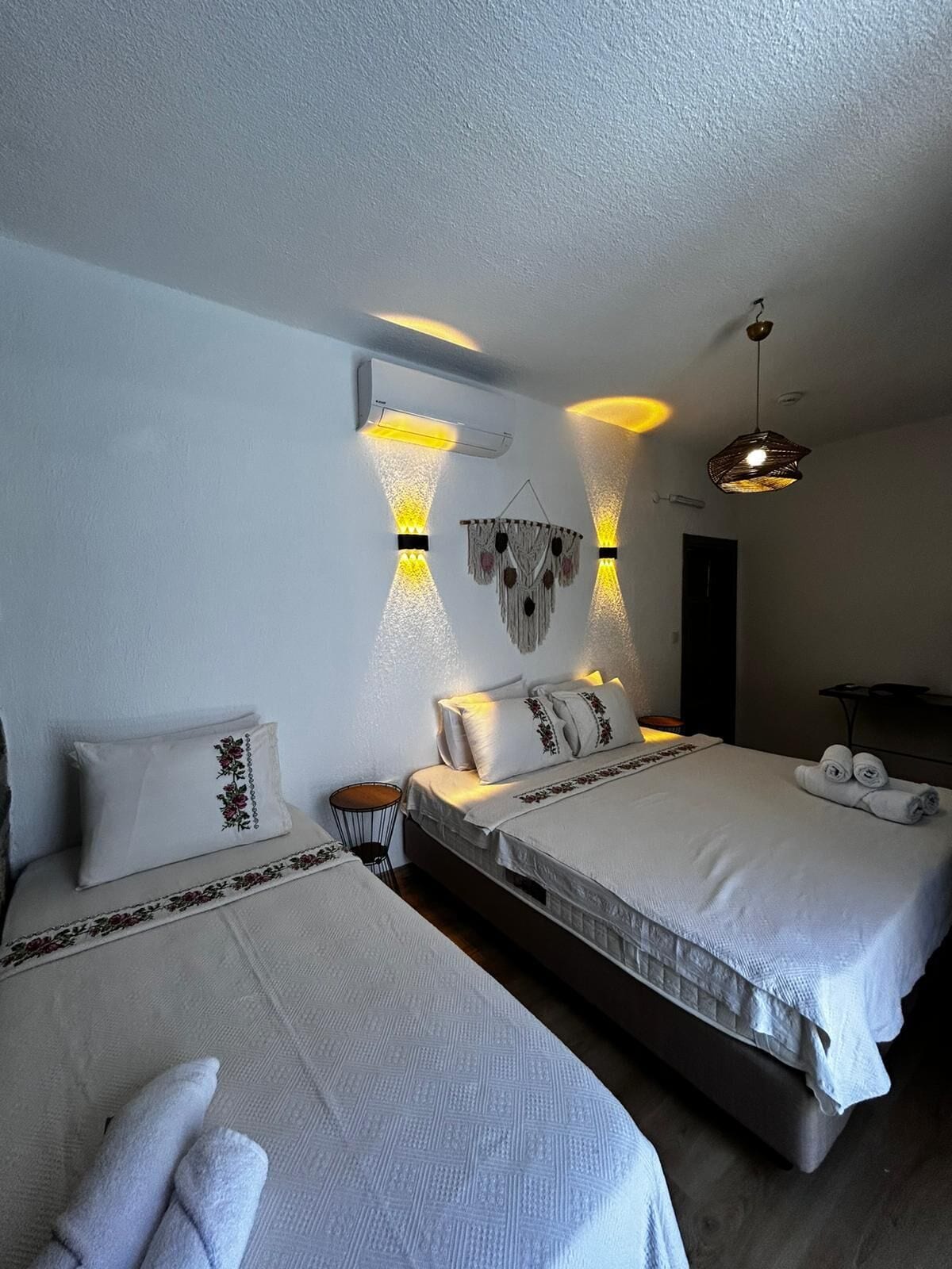 Deluxe Triple Room, Garden View | Desk, laptop workspace, blackout curtains, soundproofing