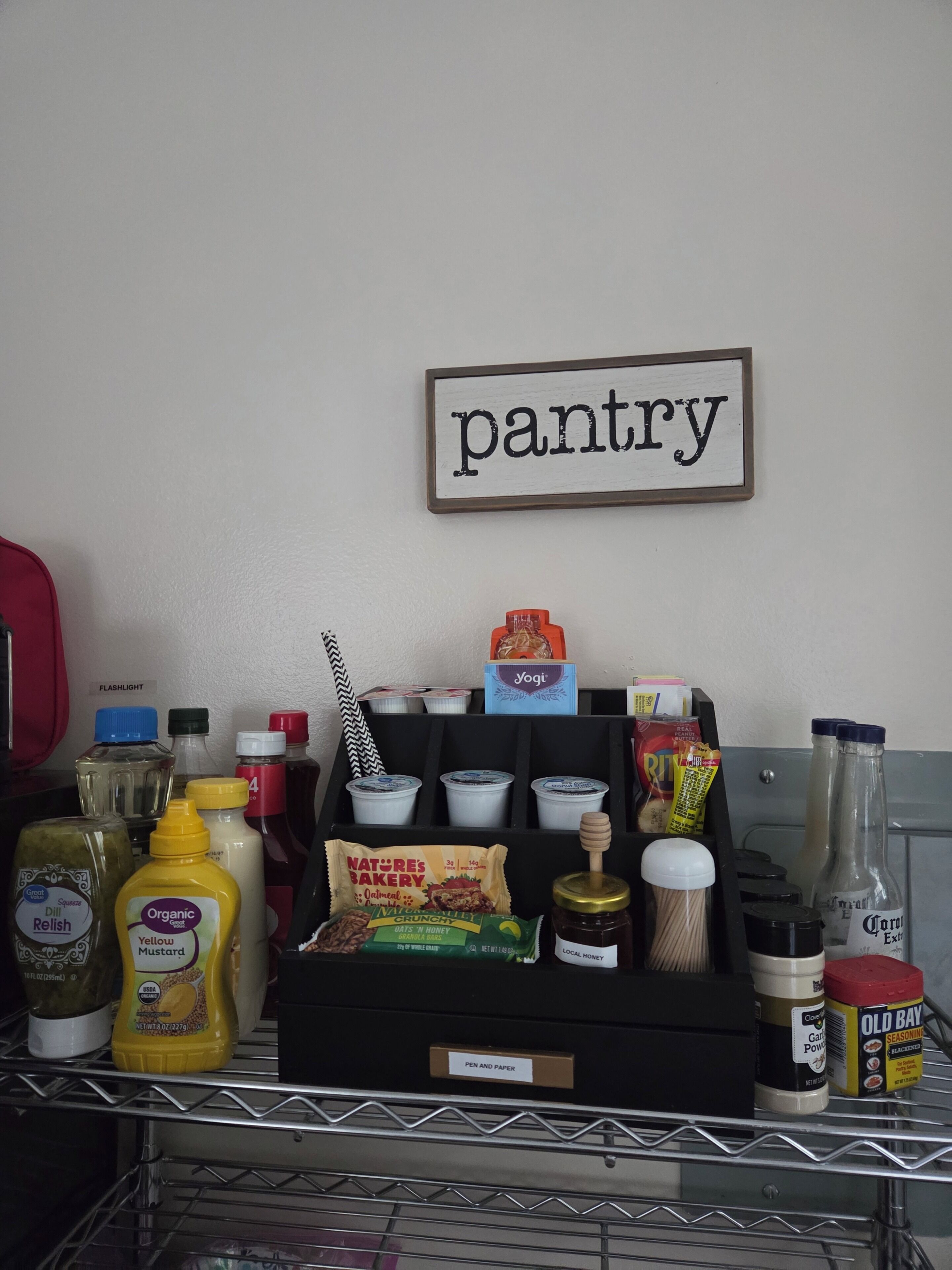 A pantry with various food items and condiments.