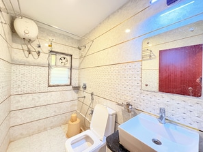 Deluxe Quadruple Room, City View | Bathroom | Shower, free toiletries, towels - The Bj (Puri)