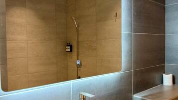 Hair dryer, towels, shampoo, toilet paper