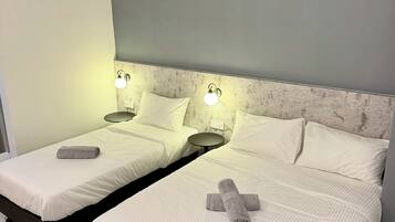 Family Triple Room, Non Smoking | Desk, laptop workspace, iron/ironing board (on request), WiFi (free)