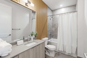 Shower, hair dryer, towels, shampoo - DTWN Boutique Townhome + Basement Suite |Sleeps 10 (Toronto)