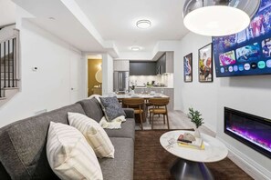 TV, fireplace, offices - DTWN Boutique Townhome + Basement Suite |Sleeps 10 (Toronto)