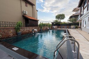 Seasonal outdoor pool, pool umbrellas, sun loungers