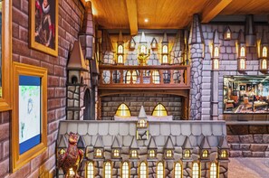 A model of a medieval-style building with multiple levels, stone walls, and a variety of windows. - 10BR house at Windsor Cay resort, sleeps 22 (Clermont)