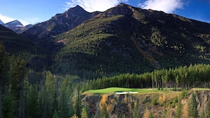 A mountainous landscape with a golf course.