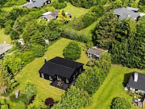 A residential area with multiple houses surrounded by dense greenery. - 4 Star Holiday Home in Gilleleje (Gilleleje)