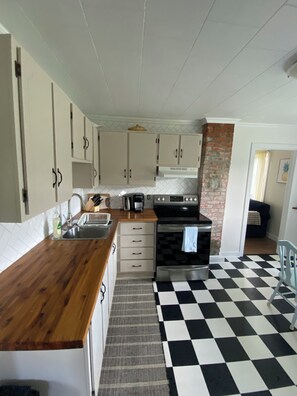 Private kitchen - Cozy 2-bedroom cabin in peaceful New Chelsea, perfect for relaxing getaway! (Winterton)
