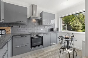 Fridge, microwave, oven, toaster - A beautifully presented holiday home in Tenby with parking (Tenby)