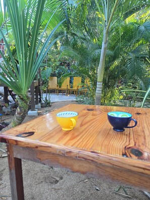 Outdoor dining - Open design 2-bedroom Palapa house in Barra de Navidad. Artist home for  summer. (Barra de Navidad)