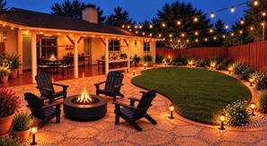 A backyard patio with a fire pit, outdoor seating, and string lights. - Beautifully Remodeled 4BR Phoenix Desert Garden Retreat (Phoenix)