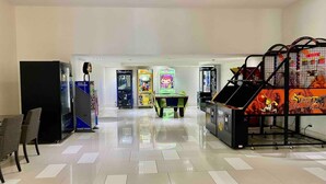 A spacious lobby with a tiled floor, vending machines, and arcade games. - L15 Ocean View Suite with 2 Beds (Surfers Paradise)