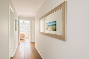 Iron/ironing board, WiFi, bed sheets - Relaxing 2BR Getaway: Nespresso, WiFi & Parking (Runaway Bay)