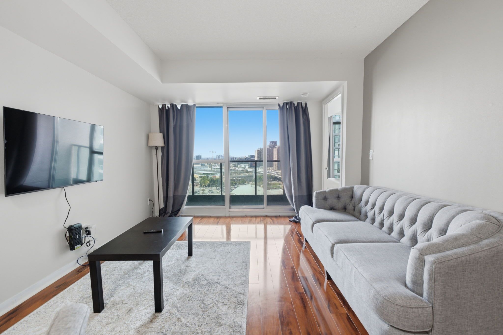 Bright and cozy living space with smart TV for relaxing nights in.
