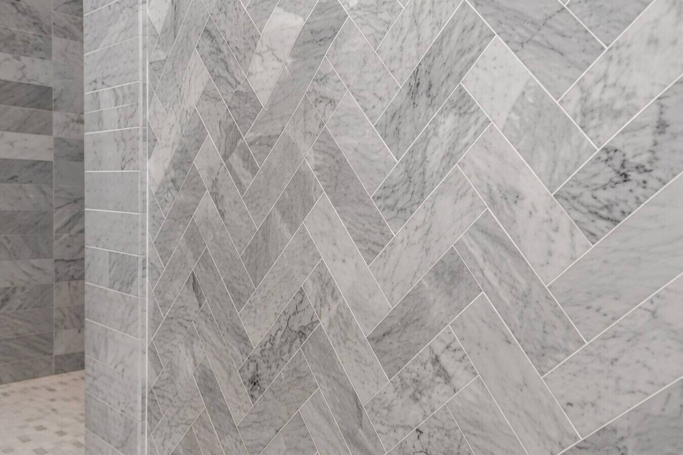 A herringbone-patterned marble wall.