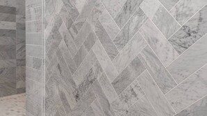 A herringbone-patterned marble wall.