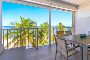 Luxury Condo, 2 Bedrooms, Kitchen, Beachfront | Outdoor dining - Cayman Luxury Rentals at Coral Bay (Savannah)