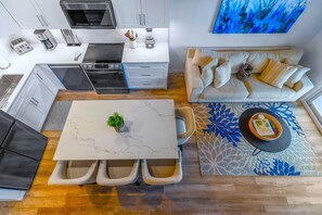 Luxury Condo, 2 Bedrooms, Kitchen, Beachfront | Living area - Cayman Luxury Rentals at Coral Bay (Savannah)