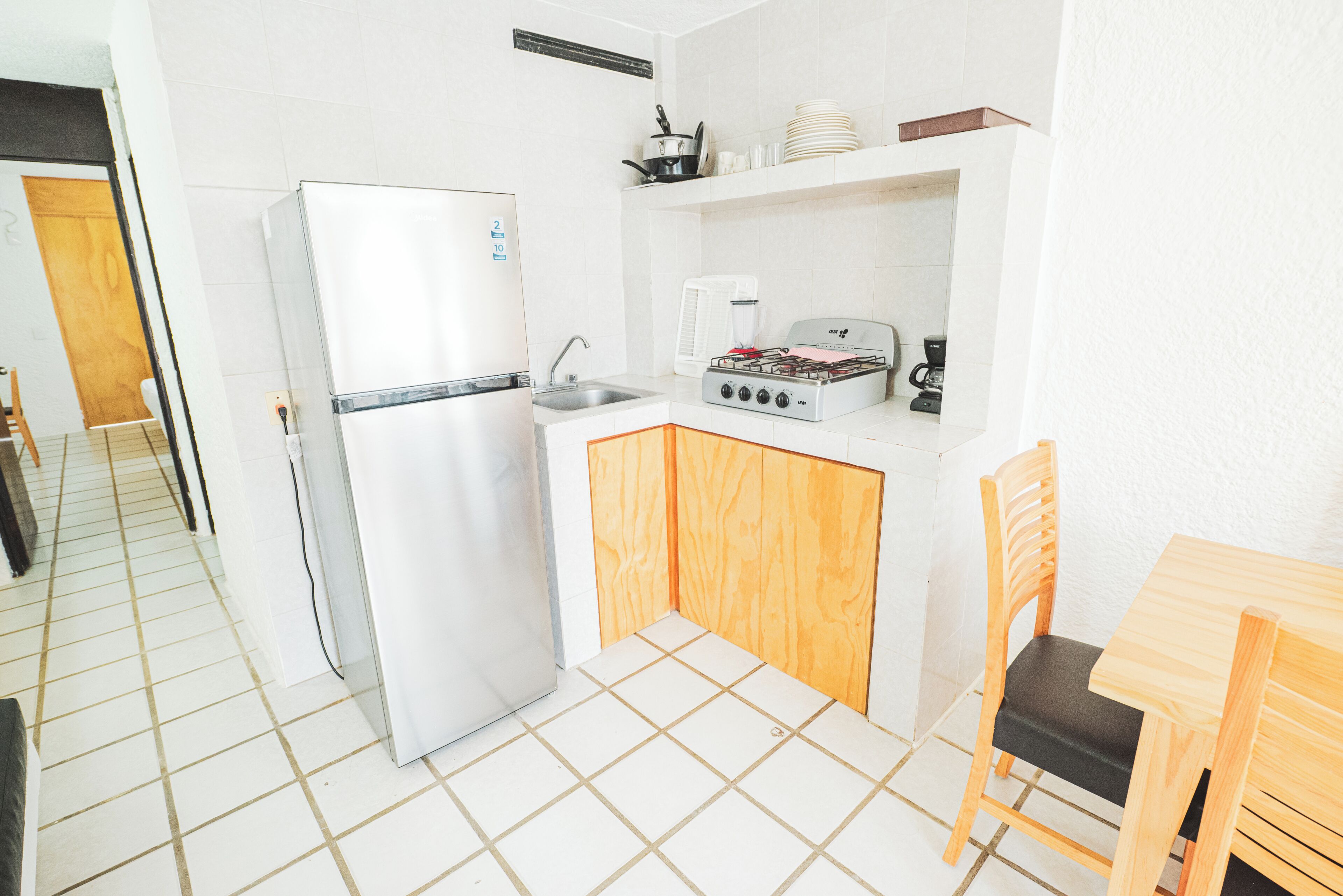 Standard Suite, Balcony | Private kitchen | Fridge, microwave, cookware/dishes/utensils, dining tables