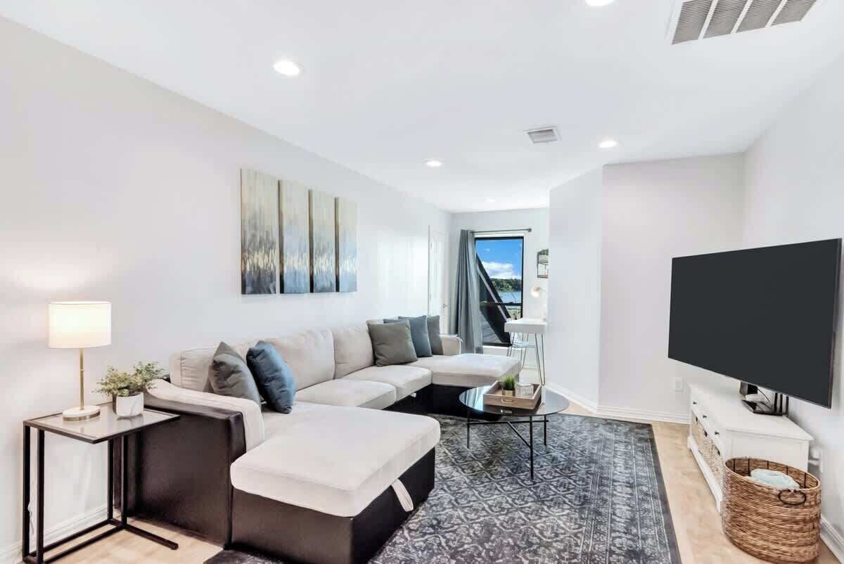Settle in for movie night in the villa’s first-floor media room, with sectional seating, a large TV and an adjoining full bathroom.